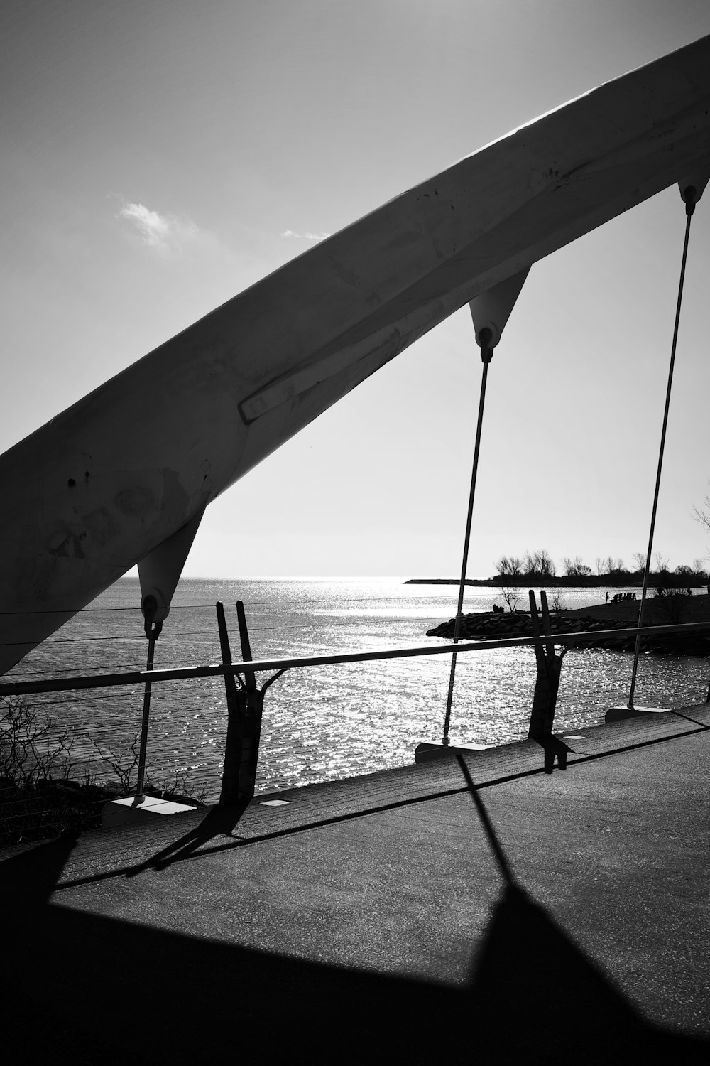 a black and white photo of a boat on the water