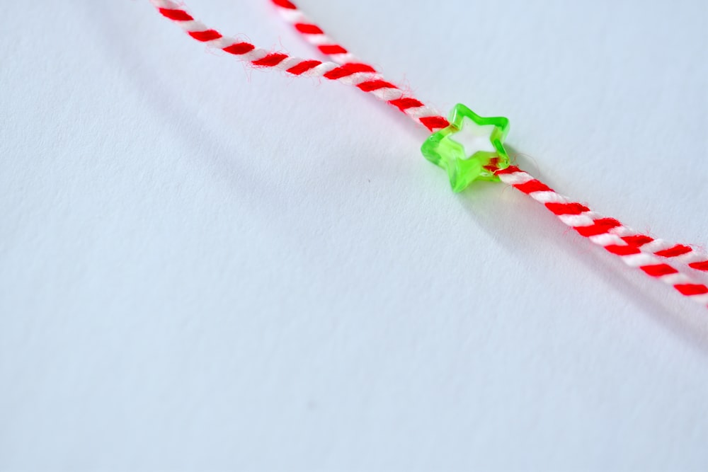 a candy cane with a green star on it
