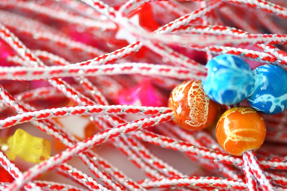 a close up of a bunch of candy on a string