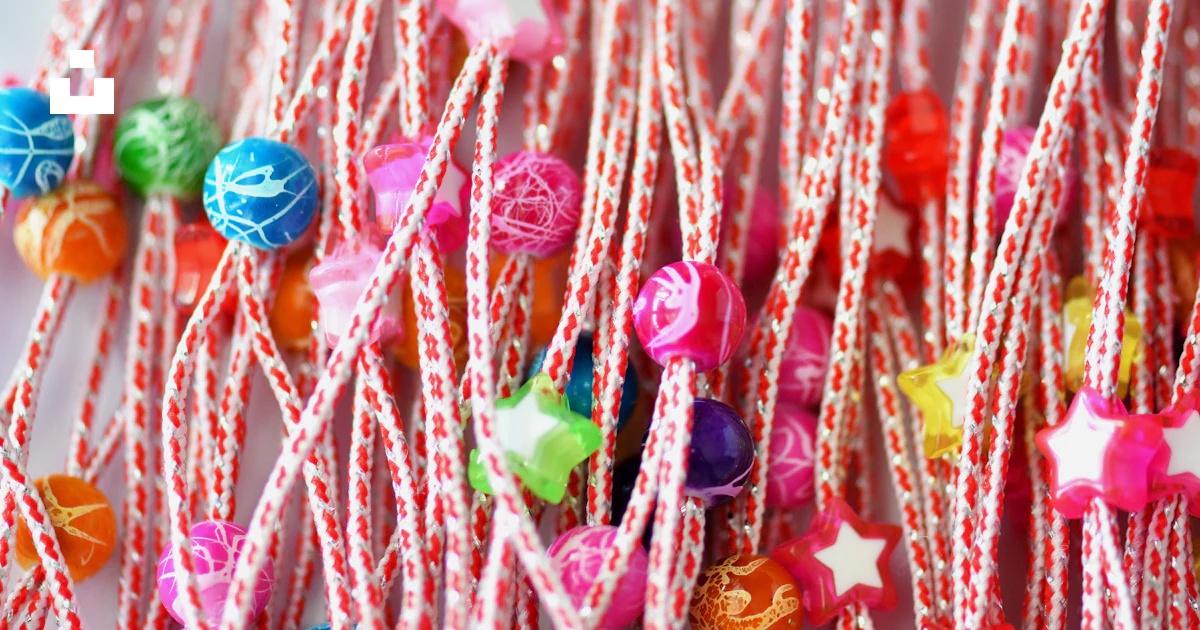 Thread With Candy Pattern A close up of a string of candy photo – Free Striped threads Image on ...