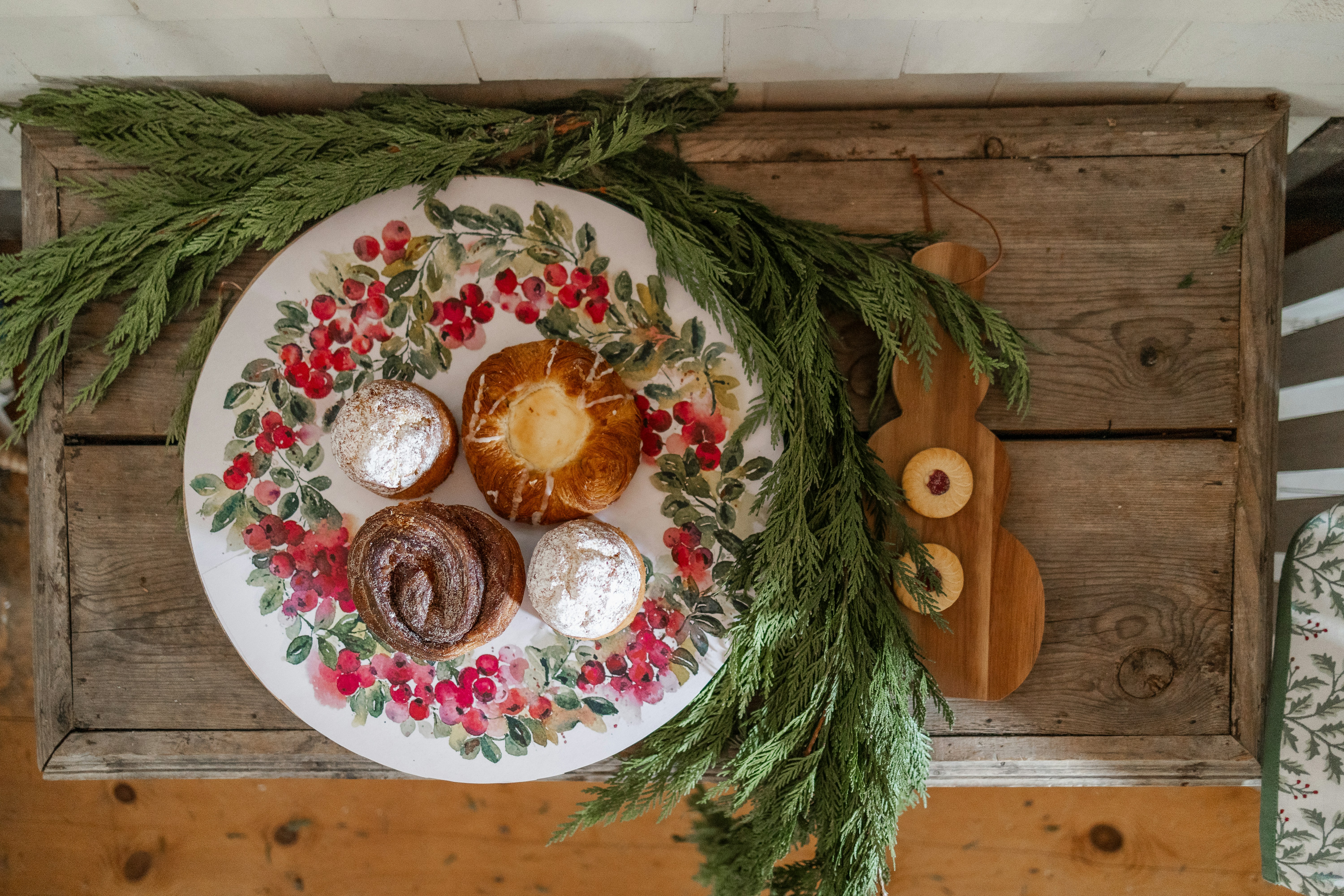 a white plate topped with pastries on top of a wooden table