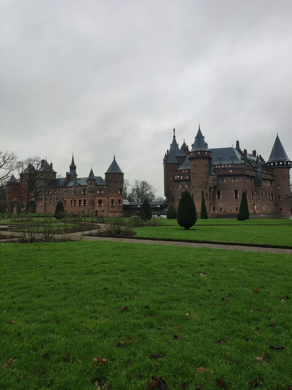 a large brick building with towers on top of it