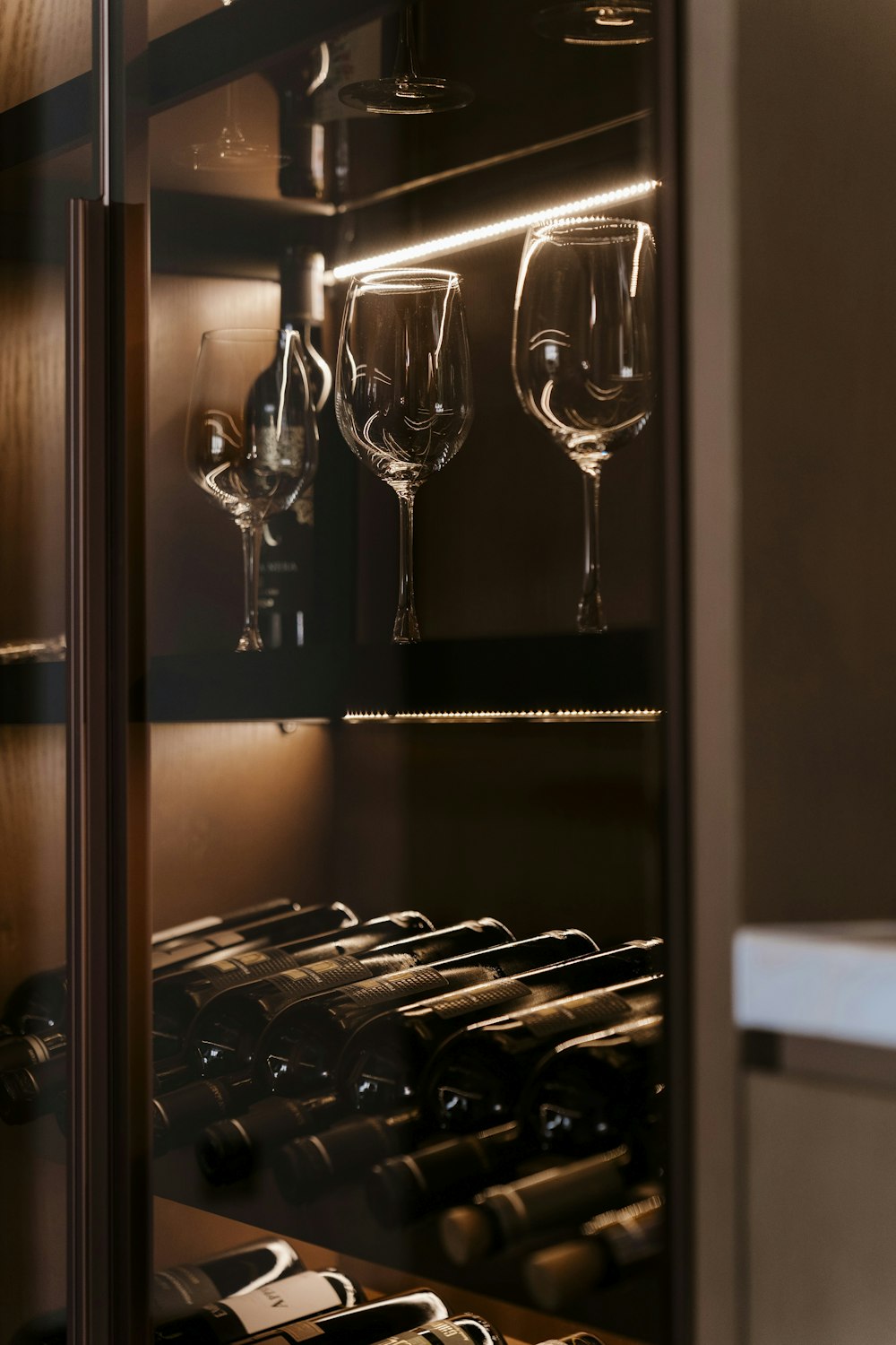 a wine cellar with several wine glasses in it
