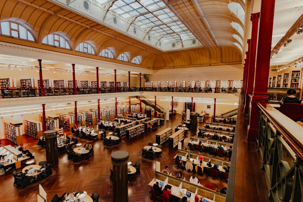 a library filled with lots of books and lots of tables