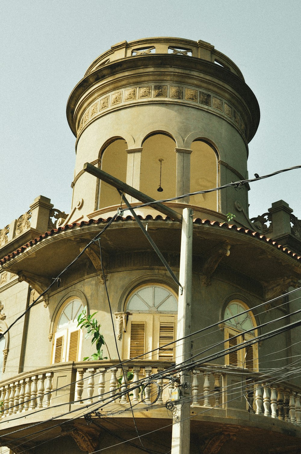 an old building with a clock on the top of it