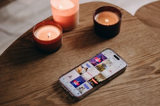 a cell phone sitting on top of a wooden table
