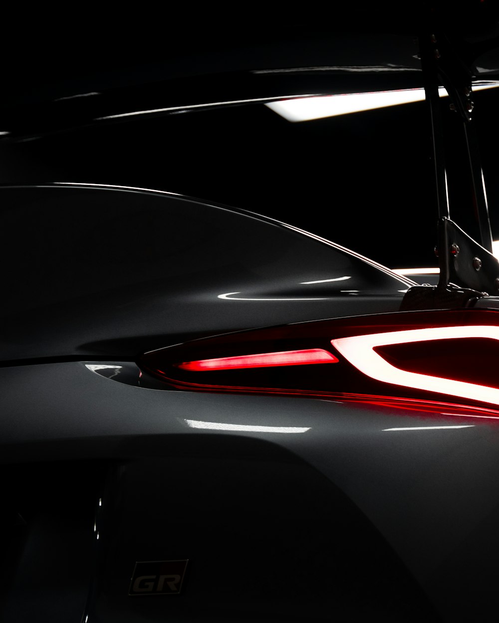 a close up of the tail lights of a sports car