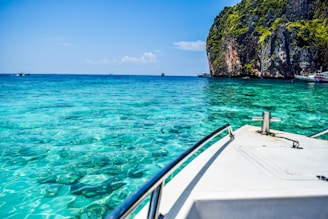 a boat is in the clear blue water