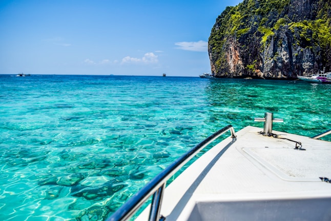 a boat is in the clear blue water