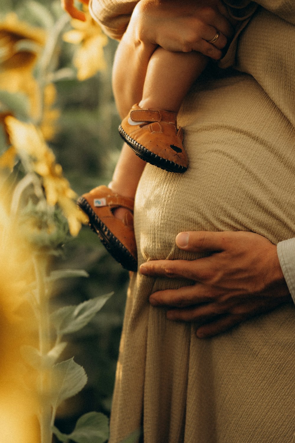 a woman holding a baby in her arms