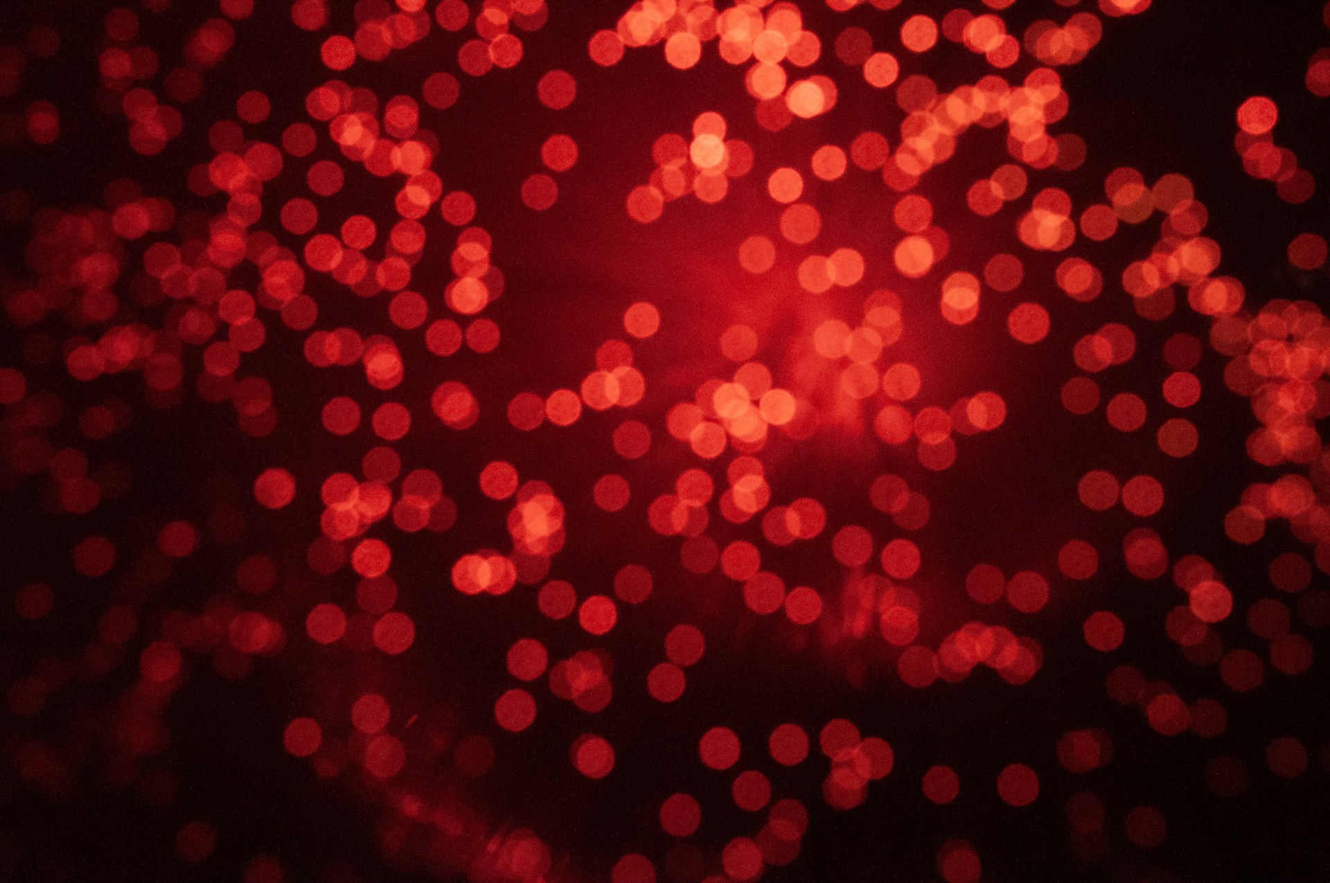 a blurry image of red lights in the dark