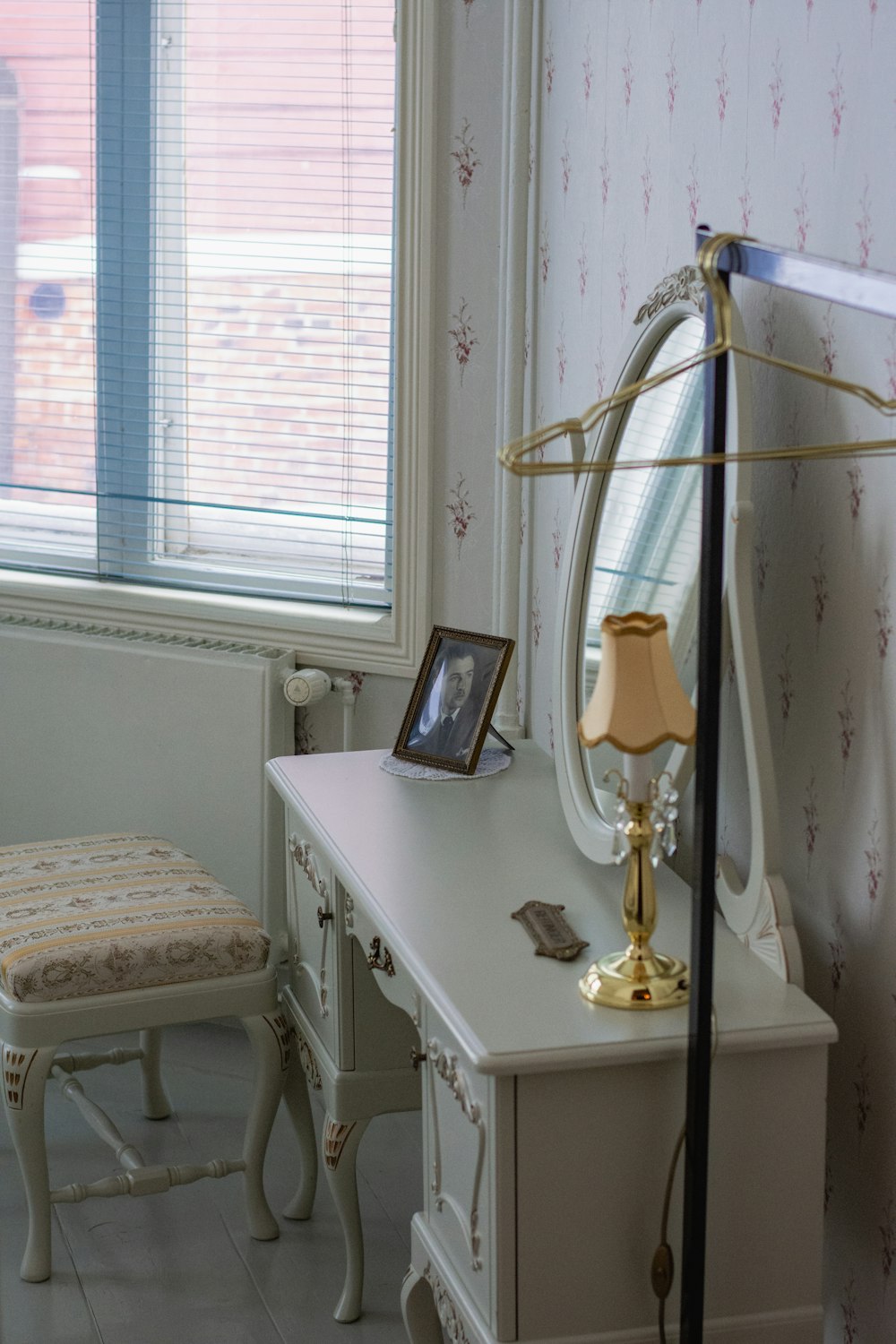 a bedroom with a desk and a chair