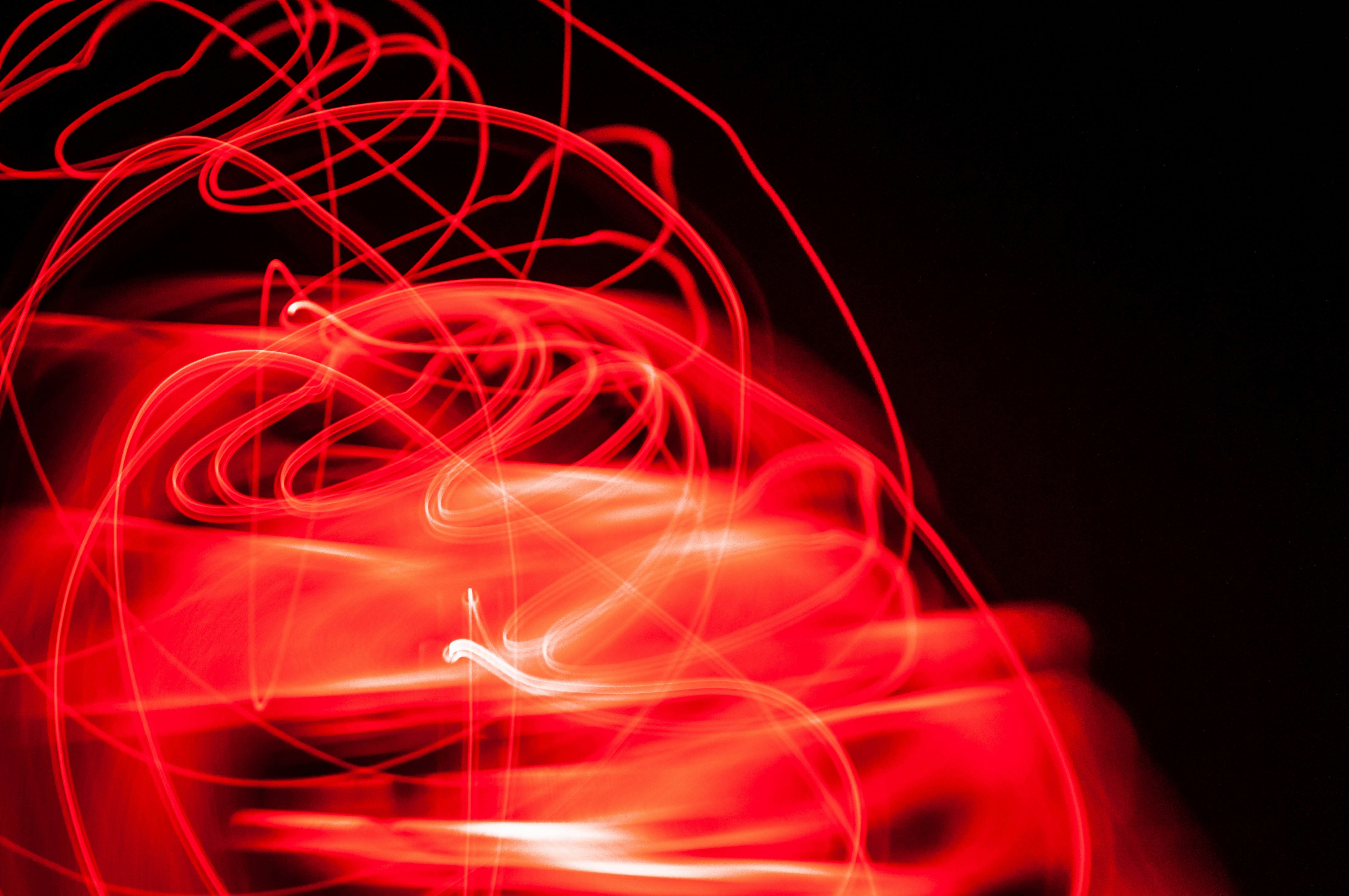 a blurry photo of a red object in the dark