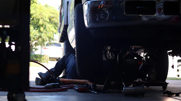Mechanic under a truck
