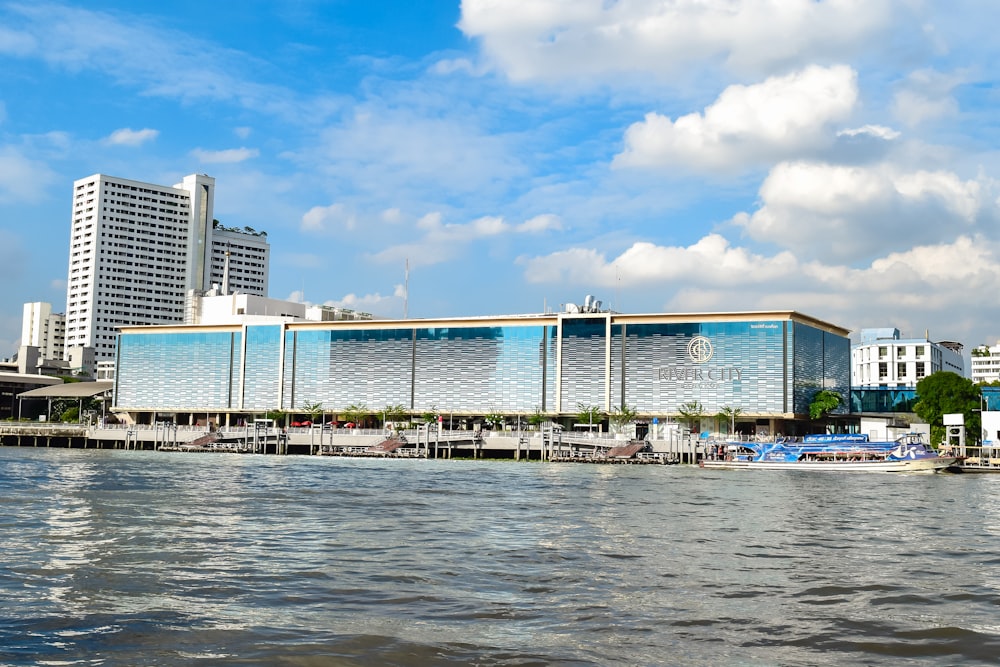 a body of water with buildings in the background