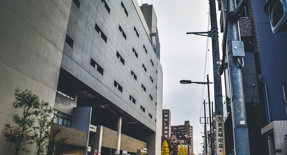 a city street filled with traffic next to tall buildings