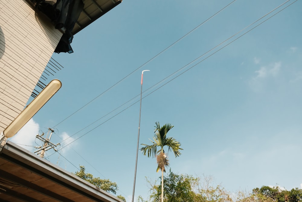 a tall pole with a clock on it next to a building