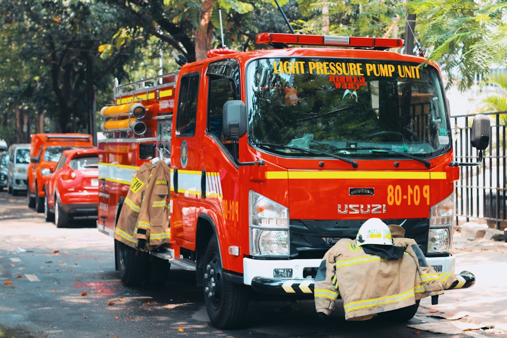a group of fire trucks parked on the side of a road