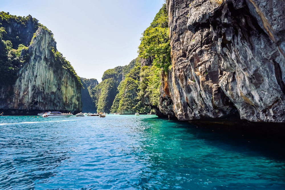 a group of boats floating on top of a body of water