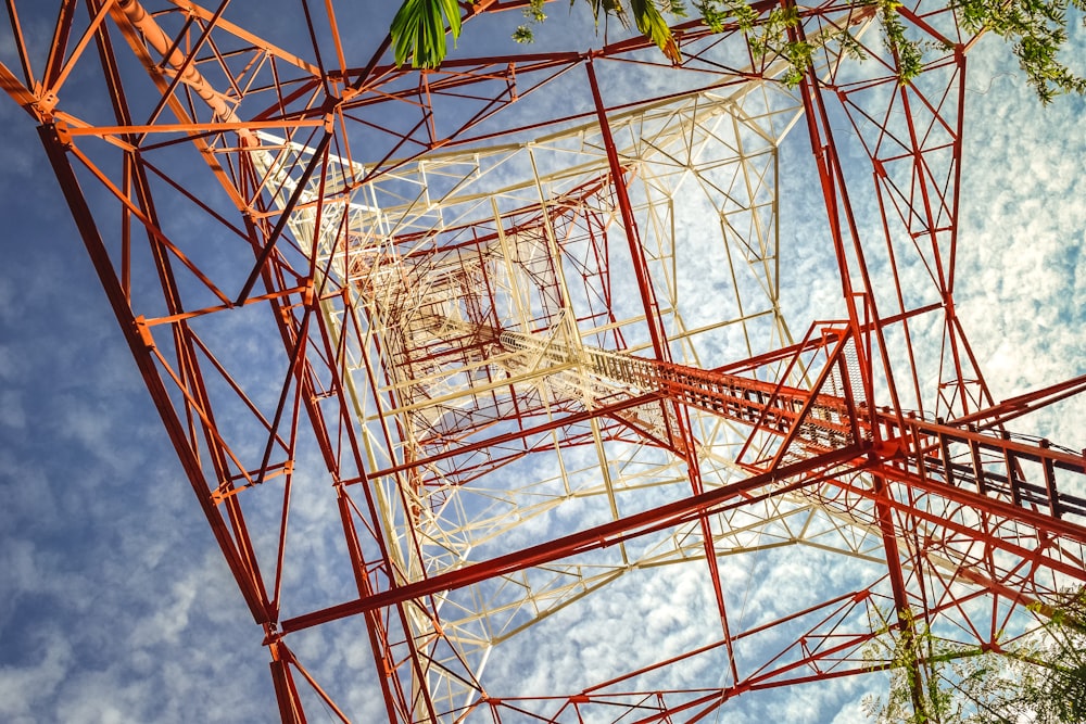 a red and white tower against a blue sky