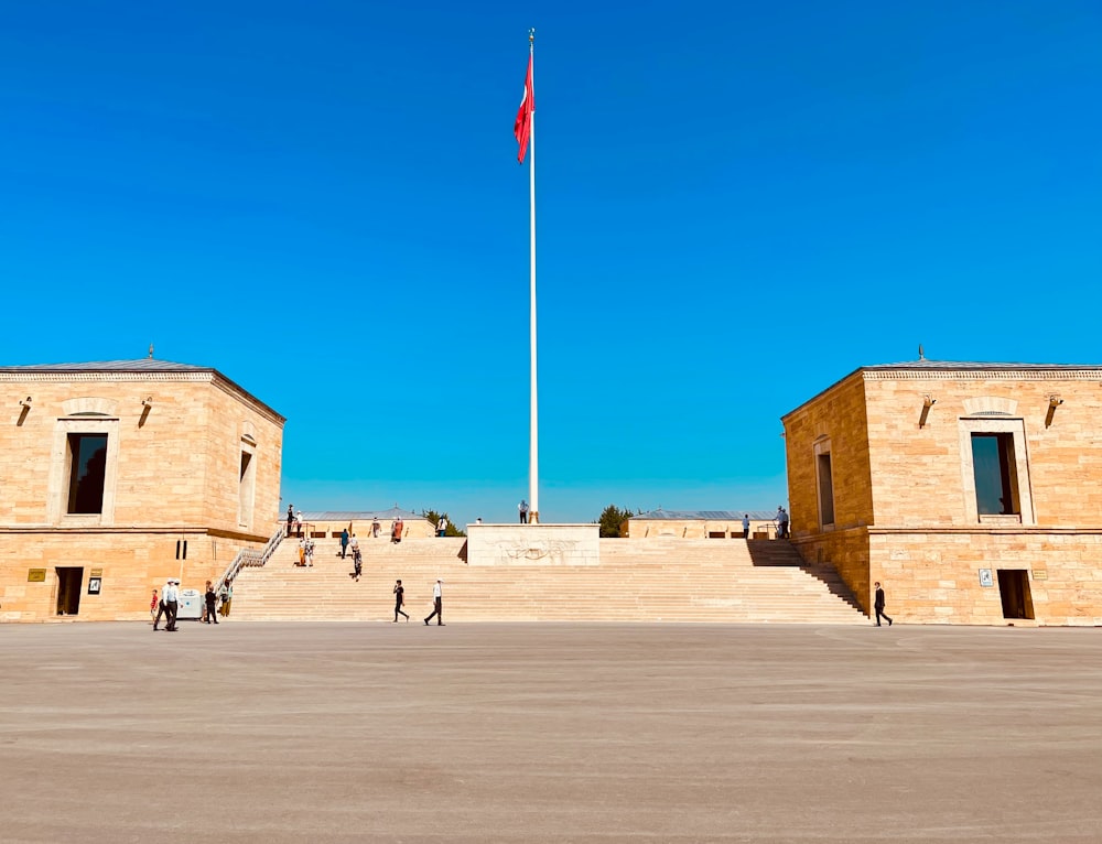 a building with a flag pole in the middle of it