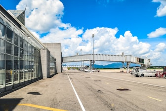 an airport terminal with a bridge over it