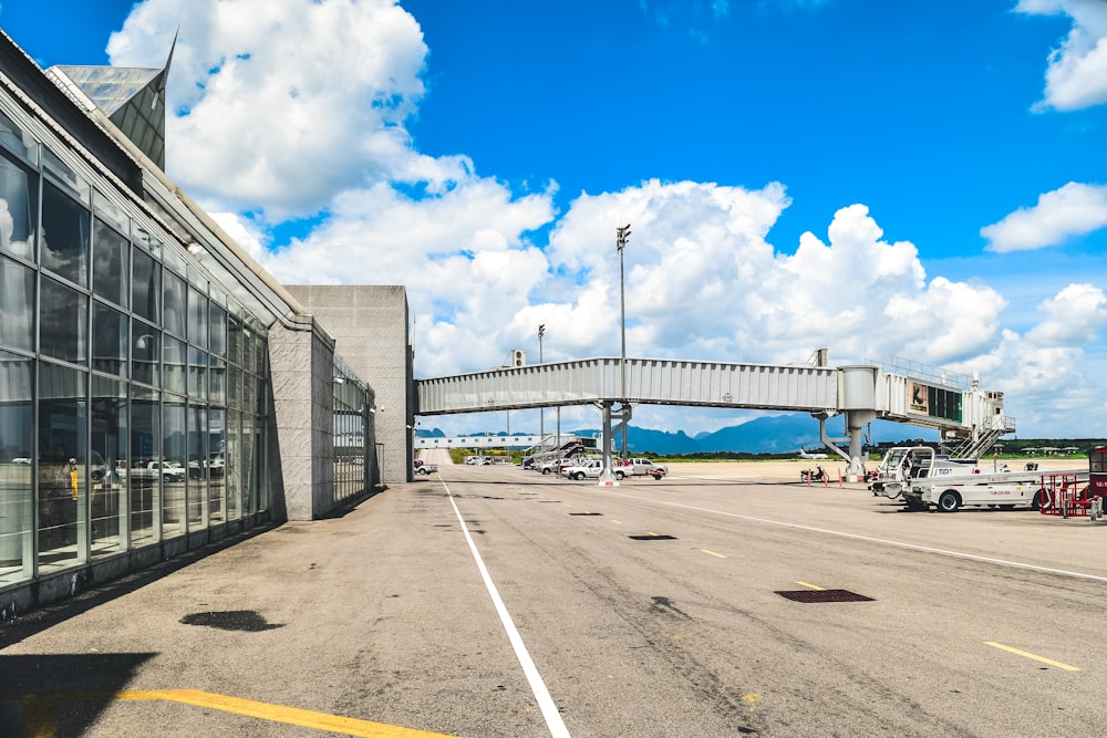 an airport terminal with a bridge over it