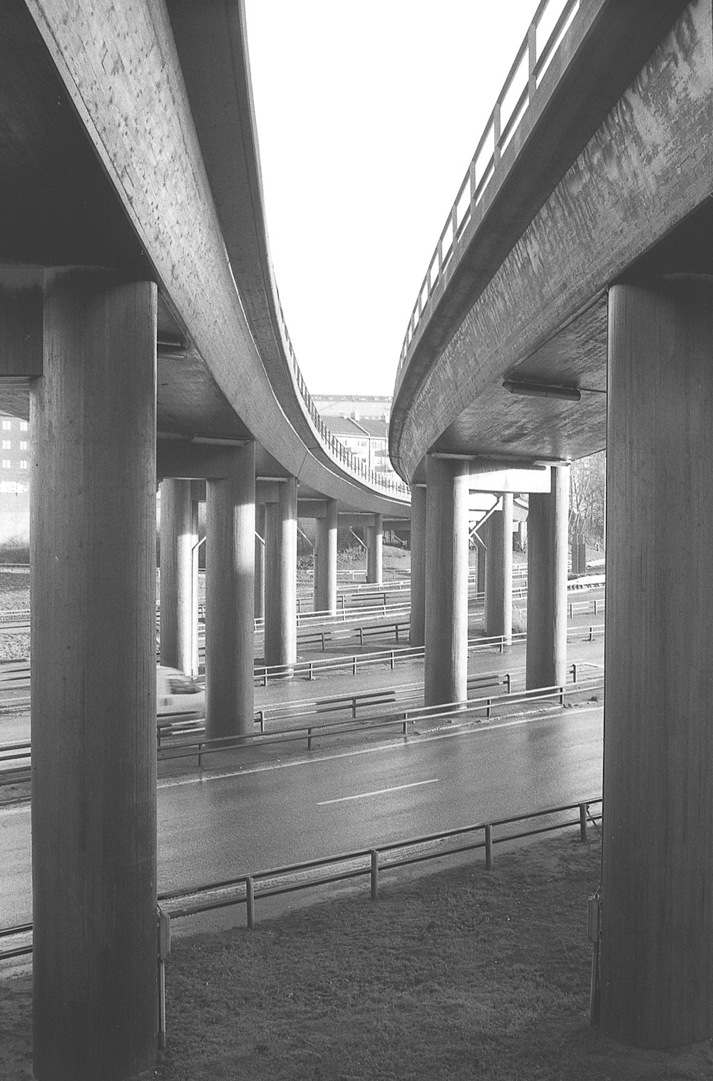 a black and white photo of a highway