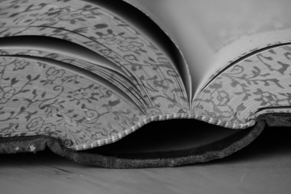 a close up of an open book on a table