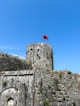 a castle with a flag on top of it