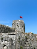 a castle with a flag on top of it
