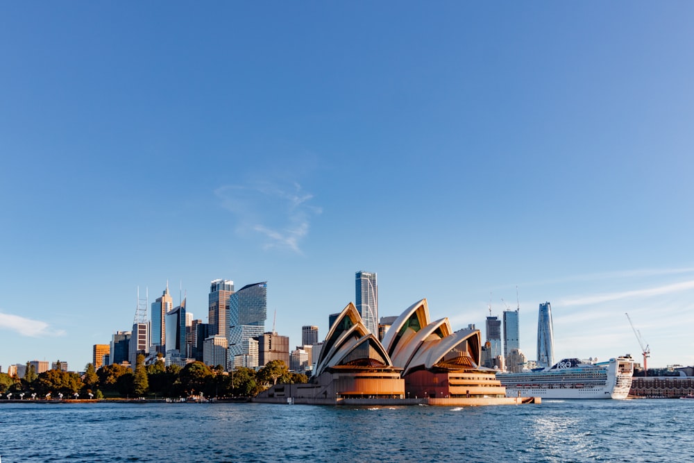 a large body of water with a city in the background