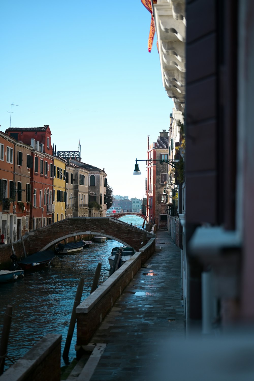 a bridge over a river with buildings in the background