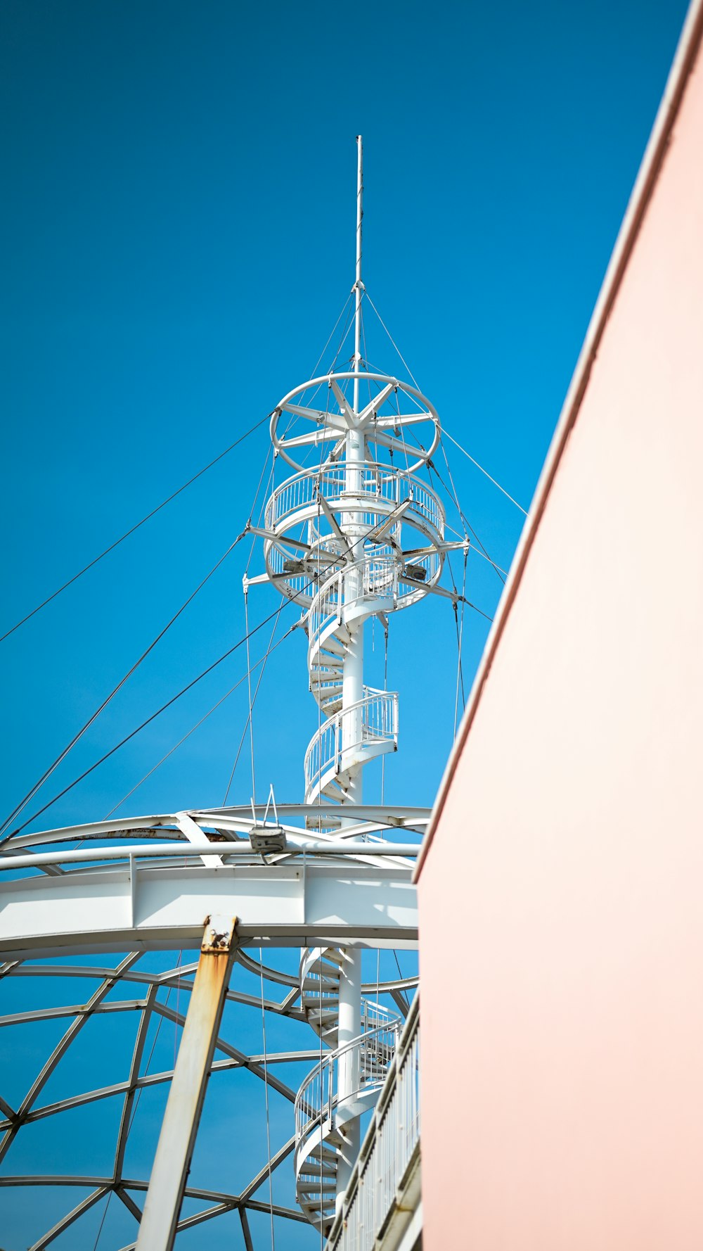 a tall white structure with a sky in the background