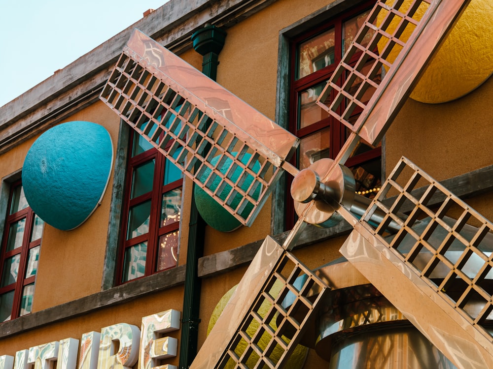 a building with a windmill on the front of it