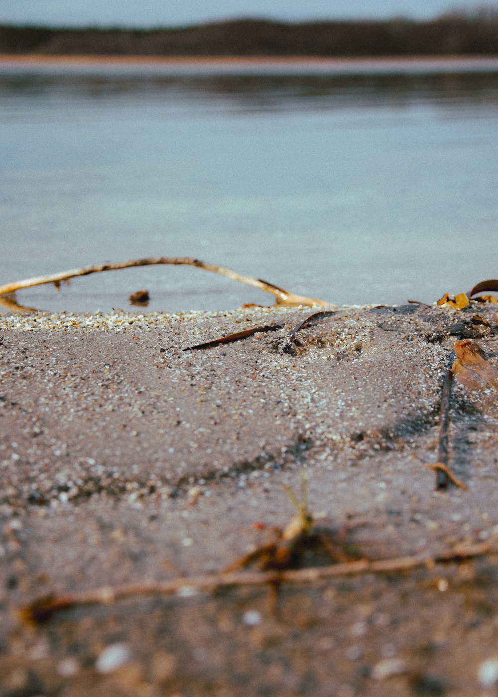 a close up of a sand and water area