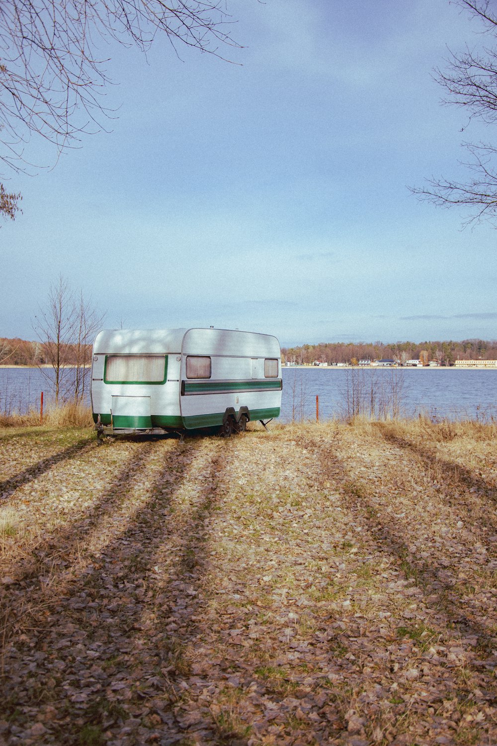 a trailer parked next to a body of water