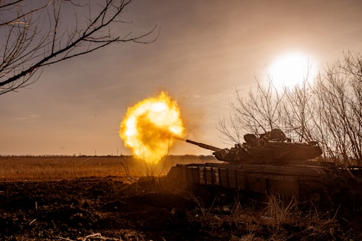 a tank that is on fire in a field