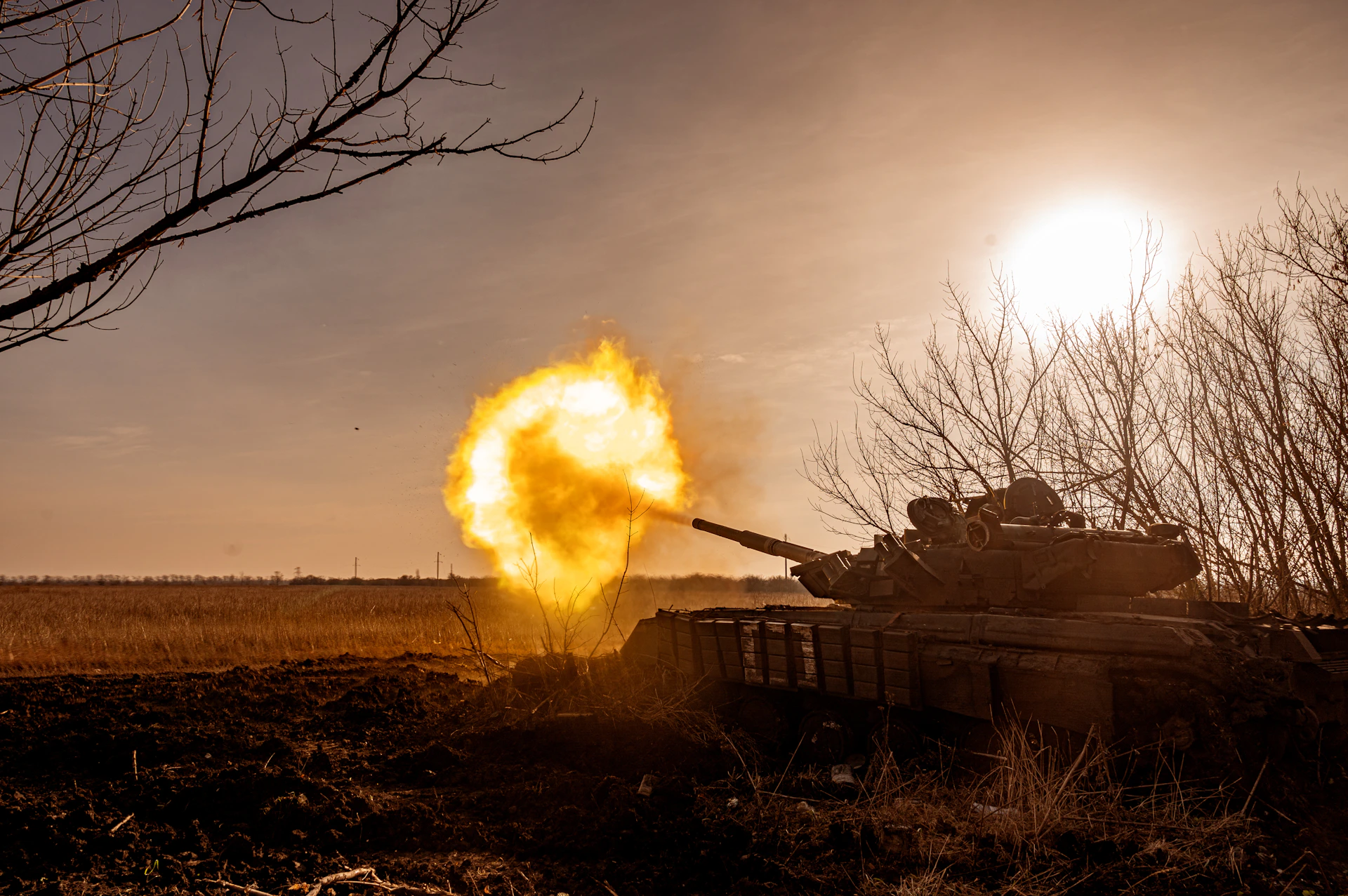 a tank that is on fire in a field