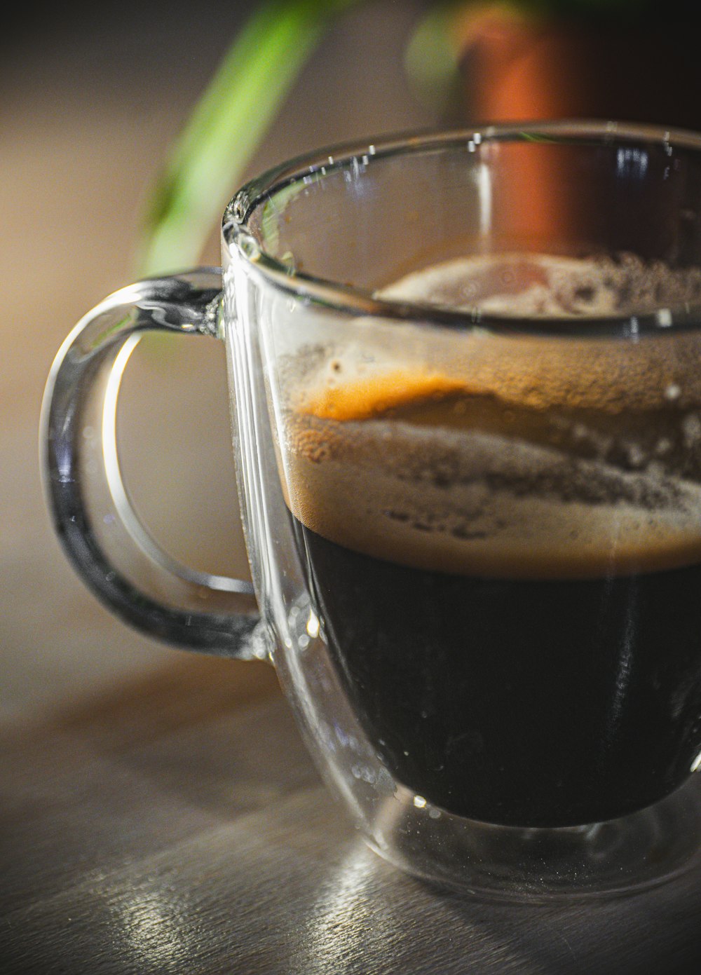 a close up of a cup of coffee on a table