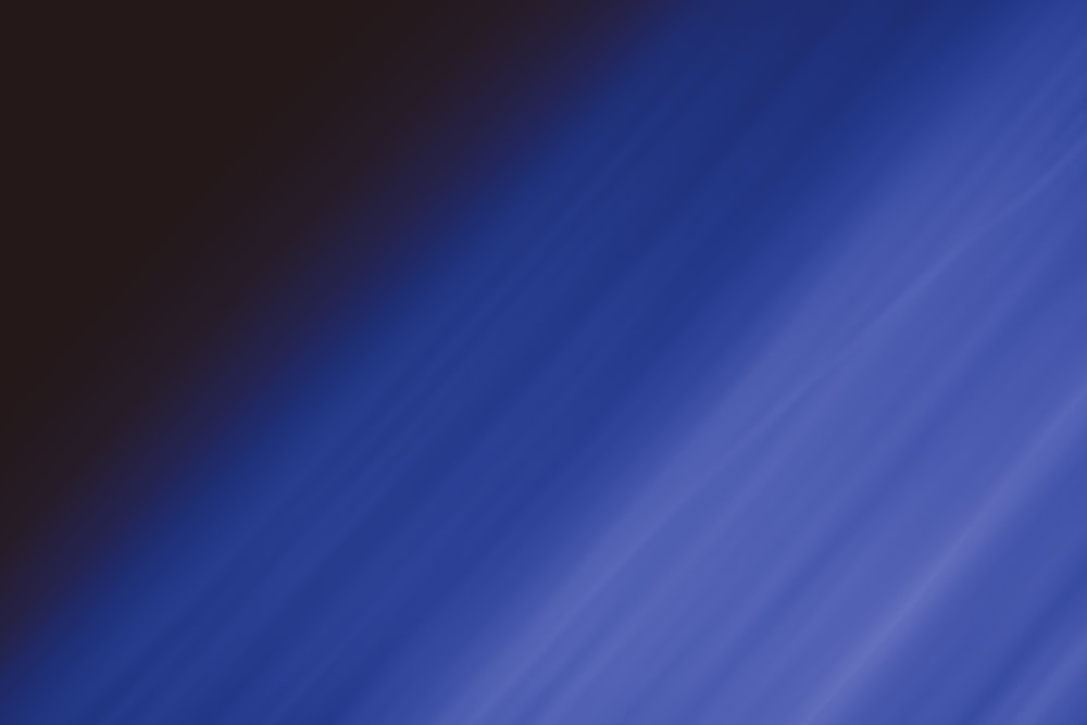 a blurry image of a blue and black background
