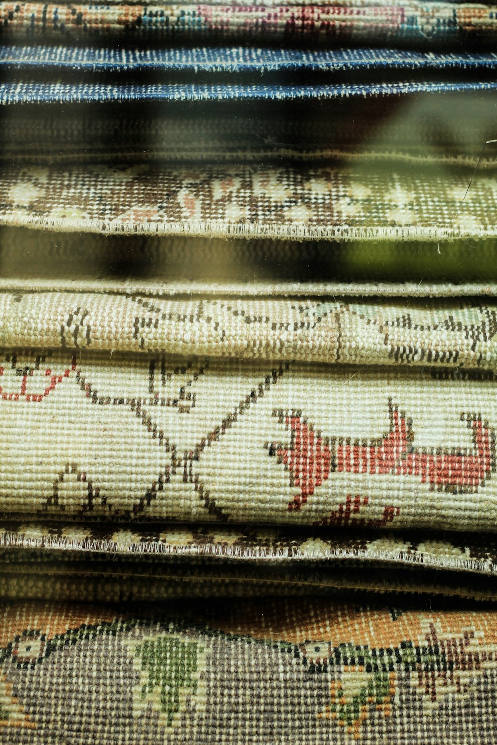 a pile of rugs sitting next to each other