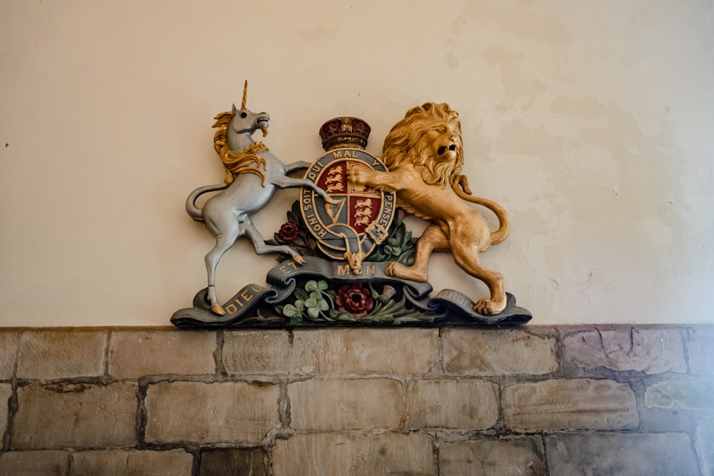 a coat of arms with a lion and a unicorn on top of it