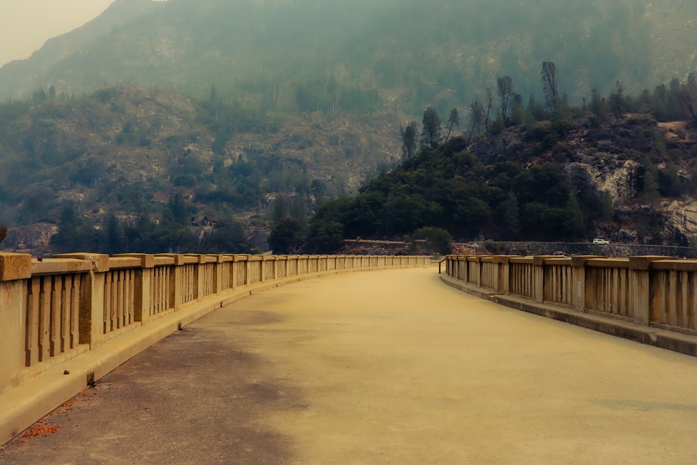 a bridge with a mountain in the background