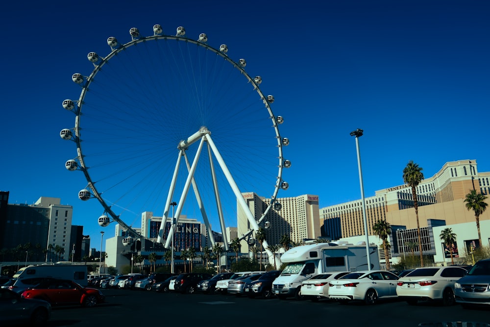 a large ferris wheel in a parking lot