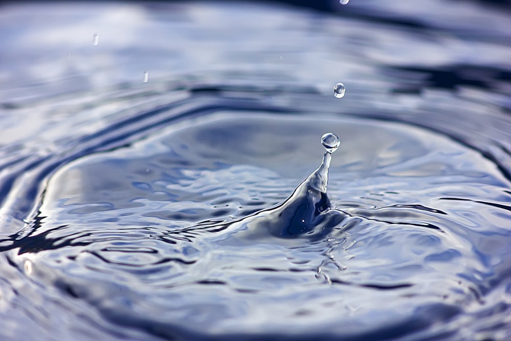 a close up of a water drop with a sky background