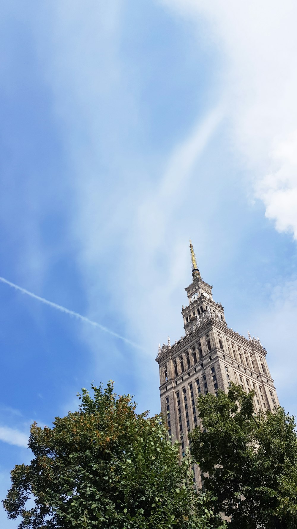 a tall tower with a clock on the top of it