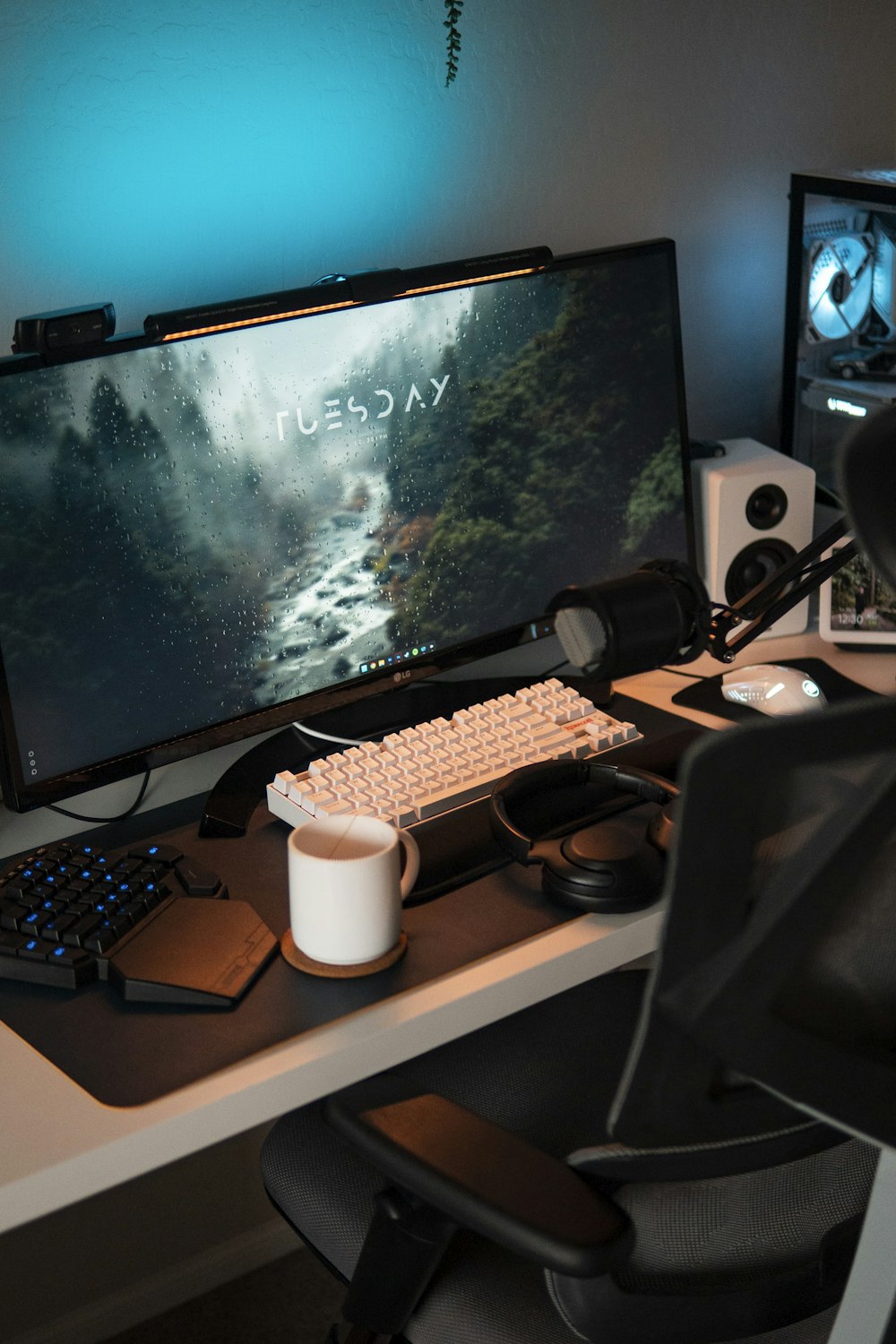 a computer desk with a keyboard, mouse and monitor