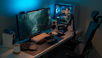 a computer desk with a monitor and keyboard