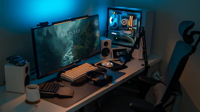a computer desk with a monitor and keyboard